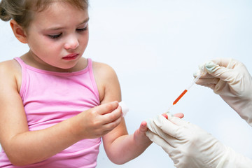 Picture of little girl having blood collection for tests