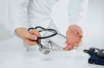 A doctor wearing a white coat talks to a patient. Medical and pharmaceutical concept. The doctor provides information about the patient's health, treatment of diseases, health problems.
