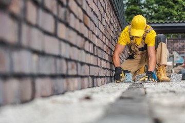 Granite Brick Paving Worker