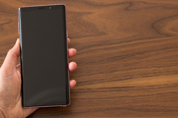  the woman use mobile phone, open apps ,shopping is easy with technology,reading news.