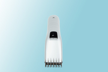 Hair clipper on a pastel blue background. The concept of cutting, improving the appearance. Going to the hairdresser, cutting hair at home. Taking care of appearance.