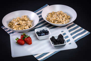 Healthy oatmeal breakfast with berries, and juice.