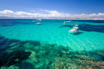 Fototapeta na wymiar Colorful summer landscape with bay, boat, blue water, sky. Balearic islands Mallorca. View on Palma de Mallorca