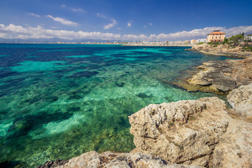 Fototapeta na wymiar coastline of Mallorca turquoise waters of Mediterranean Sea sunny day, bright colors, Balearic Island, Spain