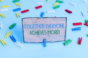 Handwriting text writing Together Everyone Achieves More. Conceptual photo Members create synergy with strong sense mutual commitment Colored clothespin papers empty reminder blue floor background