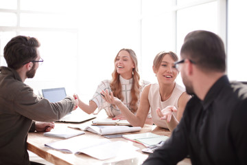 businessman looking at the handshake of business partners