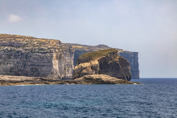 Panorama view at the coast of Dwejra Bay with the Fungus Rock on Gozo island in Malta