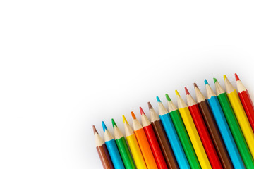 rainbow color pencils on white background