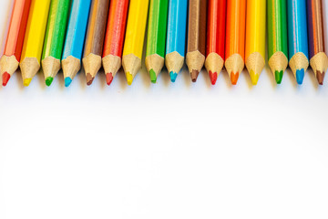 rainbow color pencils on white background