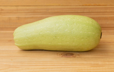Zucchini on wooden background fresh ready to cook