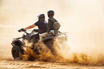 Quad bikes driving in the sand . © valdisskudre