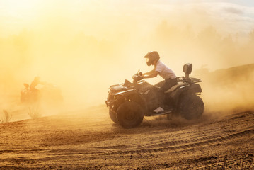 Quad bikes driving in the sand . © valdisskudre