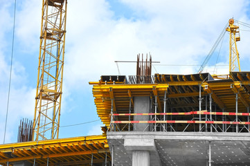 Crane and highrise construction site