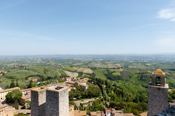 Fototapeta na wymiar Wide angle view of San Gimignano, a small walled medieval hill town in the province of Siena, Tuscany, north-central Italy, taken from the top of one of the towers