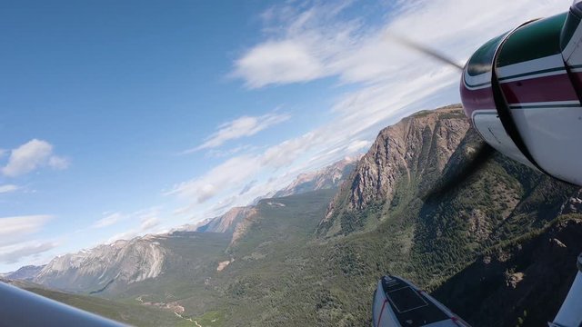 Airplane Flying Through Mountains