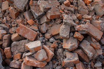 Broken brick at a construction site. Construction waste after dismantling.