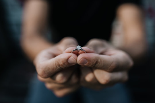 Man proposing with the engagement diamond ring