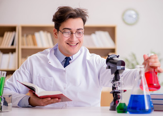 Mad crazy scientist doctor doing experiments in a laboratory