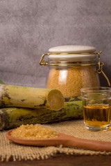 Cacha&ccedil;a is the name of a typical alcoholic drink produced in Brazil maked with sugarcane. Traditional drink from Brazil on wooden table