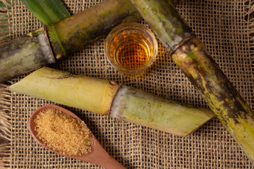 Cacha&ccedil;a is the name of a typical alcoholic drink produced in Brazil maked with sugarcane. Traditional drink from Brazil on wooden table