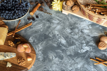 Still life with different varieties of cheese on wooden tray