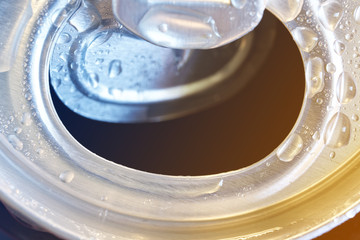 Drops of moisture on an open aluminum can. Close-up. Macro. Quenching thirst. The problem of...
