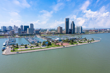Corpus Christi ocean drive. Corpus Christi City Skyline at Day in Texas - Cityscape. Panorama aerial view with skylines and marina piers row of boat, sailboat and yacht 