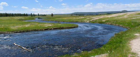 River in a prairie field in Yellowstone National Park, Wyoming, USA