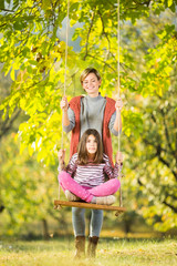 Mother and daughter in park outdoors