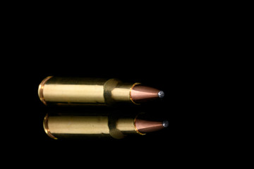 Fototapeta premium Single 222 Caliber rifle bullet on black background