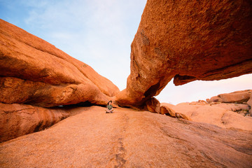 Young girl hiking in Spitzkoppe Namibia