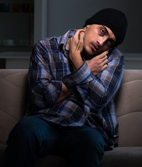 Obraz premium Young man in agony having problems with narcotics