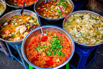 delicious fresh street food in Thailand - top view - Thai Curry, Tamarind, Tom Yam, Shrimp, Pork, Pad Thai