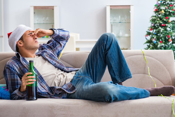 Man having hangover after christmas party