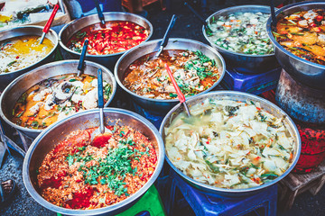 delicious fresh street food in Thailand - top view - Thai Curry, Tamarind, Tom Yam, Shrimp, Pork, Pad Thai
