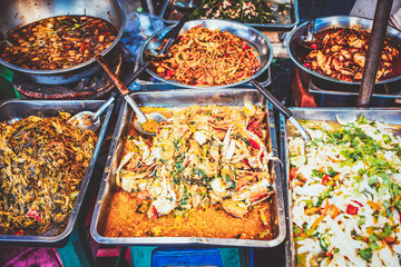 delicious fresh street food in Thailand - top view - Thai Curry, Tamarind, Tom Yam, Shrimp, Pork, Pad Thai