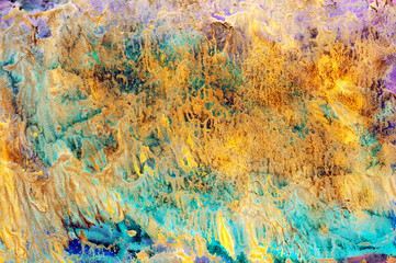 abstract textural background with yellow, green and blue paint branch lines and splashes with...