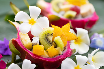 Healthy vegetarian mixed varity of fruit in dragon fruits bowl, starfruits,kiwifruits,pine apple,papaya,Concepts for healthy food