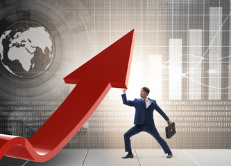 Businessman supporting growtn in economy on chart graph