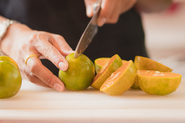 people's hand cut fruit with professional.