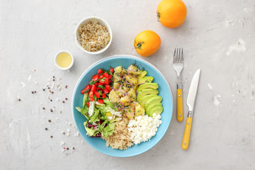 Plate with tasty salad on grunge background