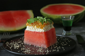 Plate with tasty salad on table, closeup