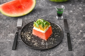 Plate with tasty salad on grunge background
