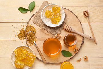 Composition with sweet honey on wooden table