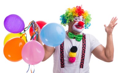 Obraz na płótnie Canvas Funny clown with balloons isolated on white background