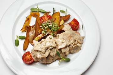 mushrooms in sauce with potatoes and a vegetables