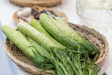 Cucumber basket on white background