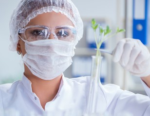 Female scientist researcher conducting an experiment in a labora