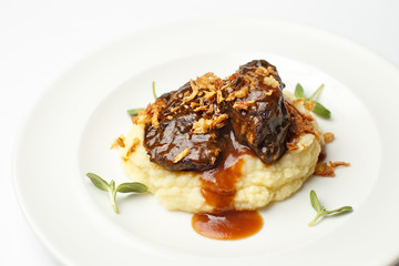 meat with potato puree on a white background