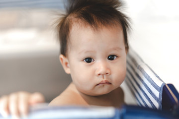 Portrait of happy smile baby relaxing on the bed